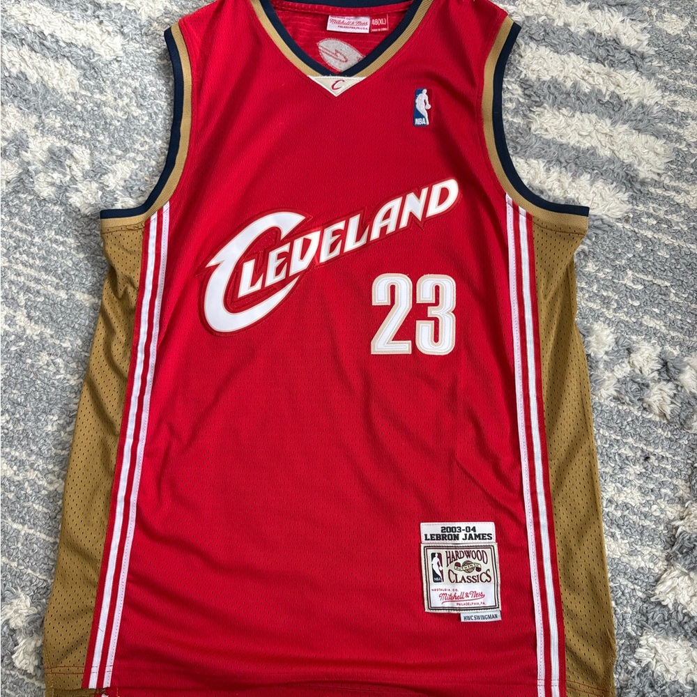 Red Cleveland Cavaliers #23 LeBron James basketball jersey by Mitchell & Ness.